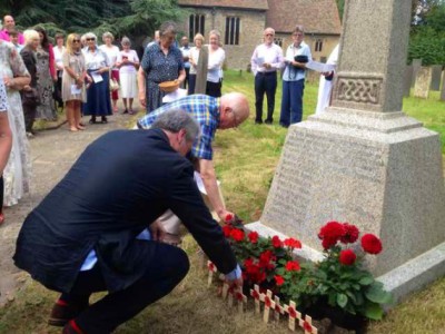 Lord Bates laying a wreath