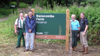 Photo of Ranscombe Farm Sign with volunteers